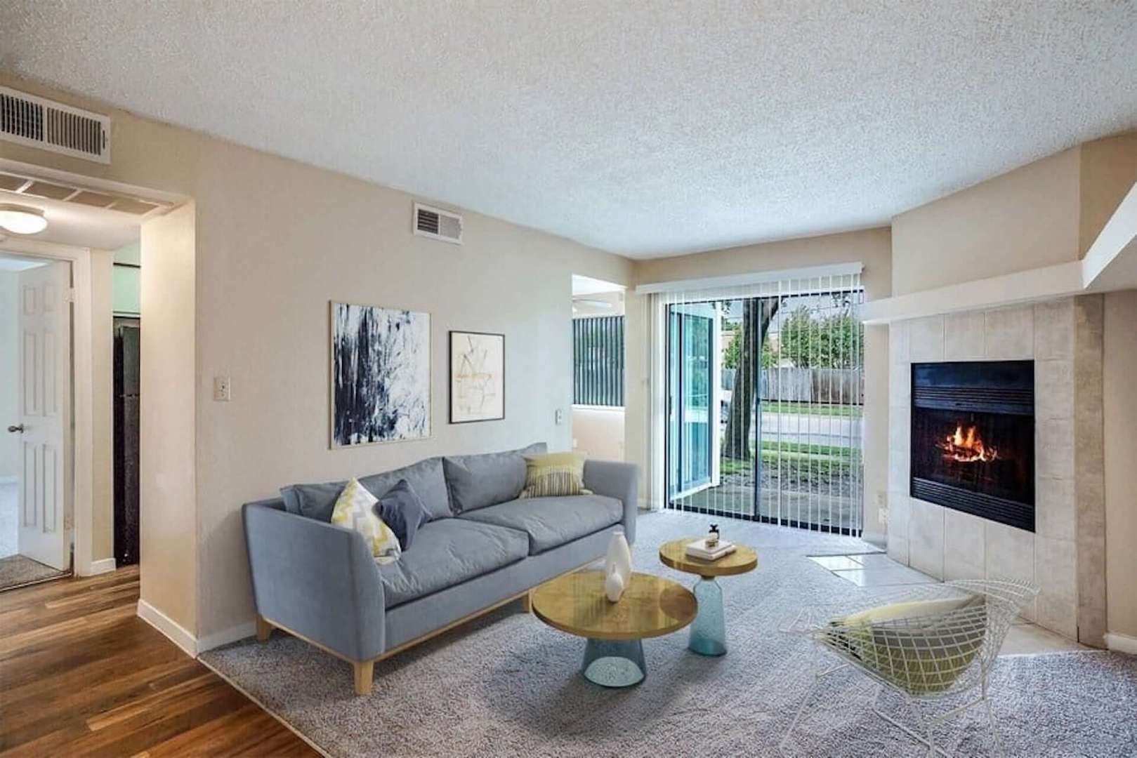 Living room with fireplace and exit to patio
