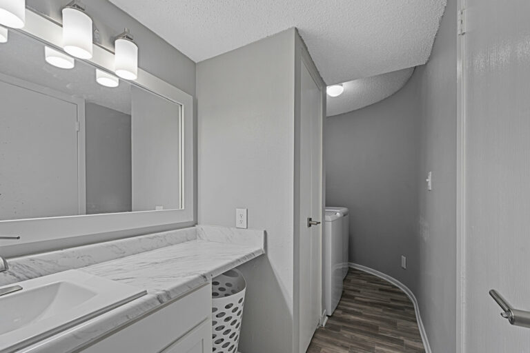washer and dryer in full bathroom