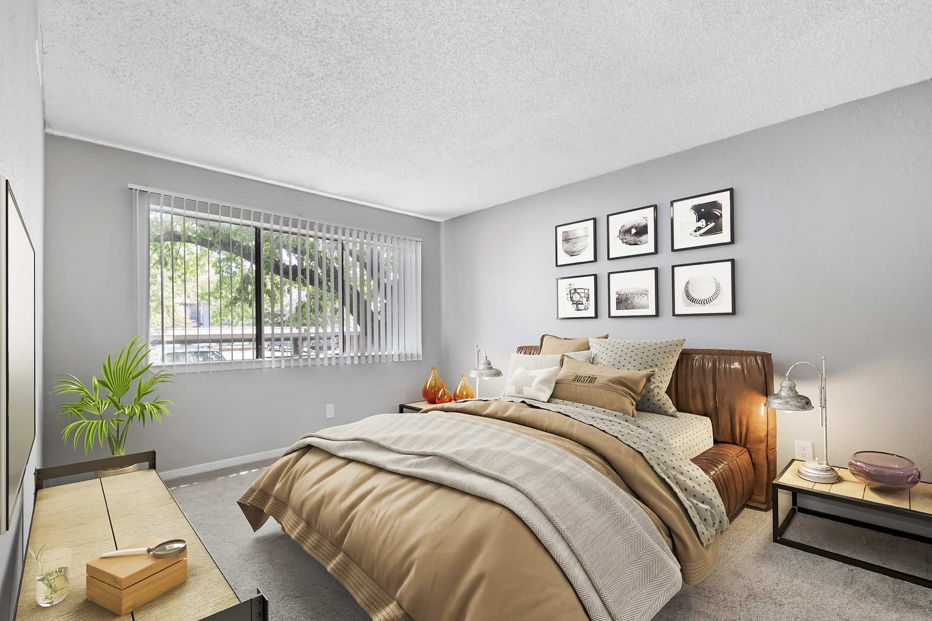 bedroom with wall art, plush carpeting and natural lighting